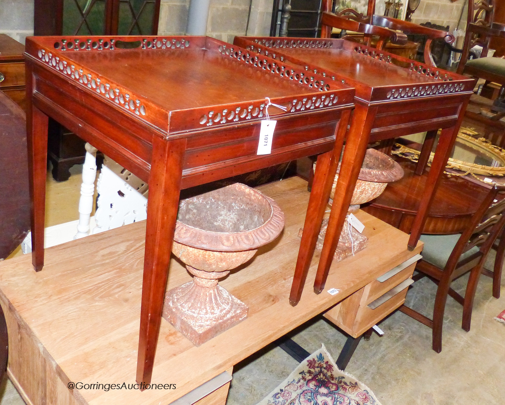 A pair of reproduction George III style mahogany fret cut square lamp tables, 56cm, height 65cm